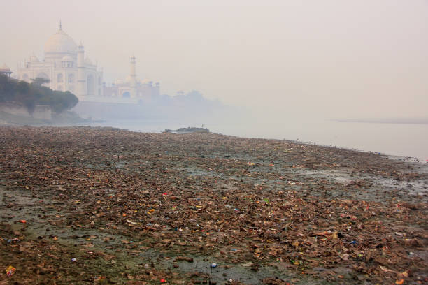 istock Yamuna river covered with garbage and Taj Mahal, Agra, India 692399940