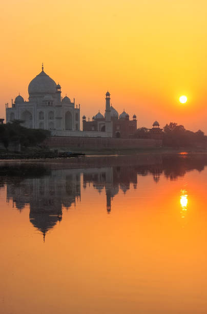 istock Taj Mahal reflected in Yamuna at sunset in Agra, India 692400350