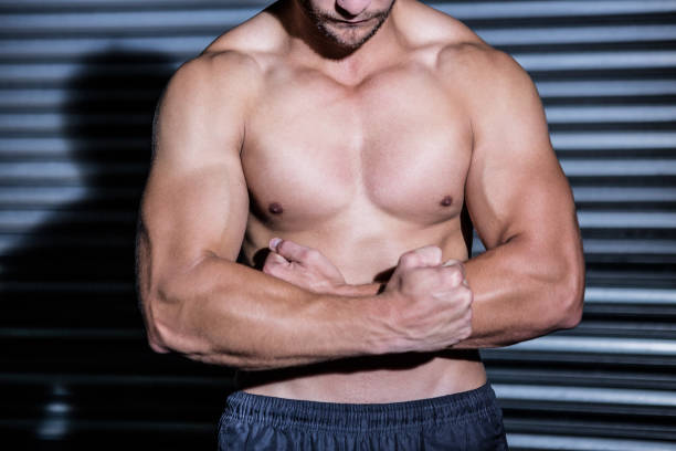 istock Muscular man with arms crossed 692406208