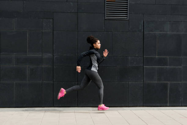 istock Side view of young female runner, outdoor training 692409730
