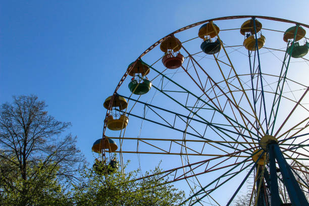 istock Ferris wheel against blue sky 692411960