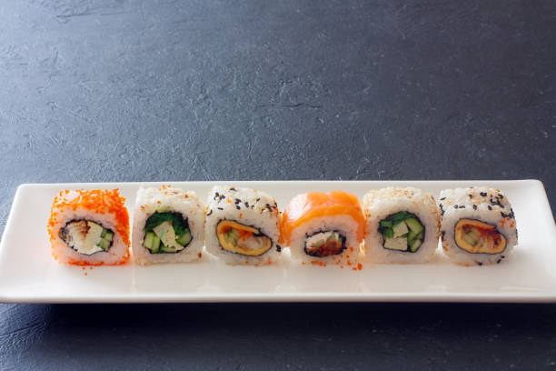 istock Set of  sushi rolls served on white plate 692412230