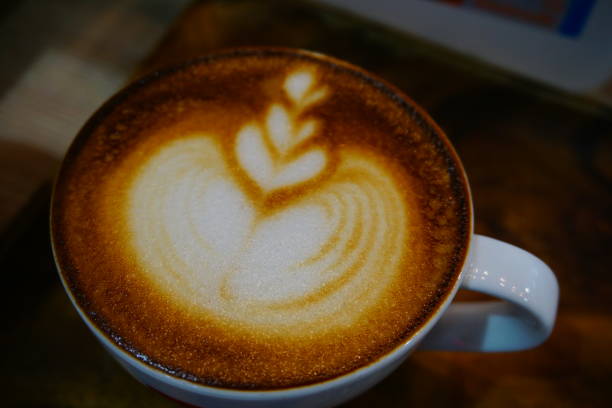 istock Cup of cafe' latte with coffee beans 692413456