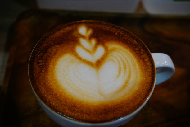 istock Cup of cafe' latte with coffee beans 692413464