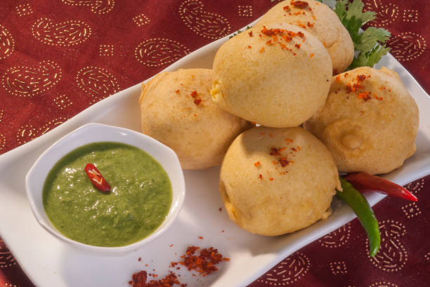 istock Batata Vada with garlic and mint chutney and chilli on white plate 692419310