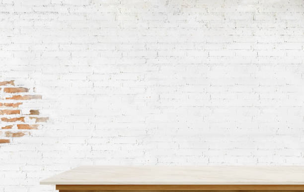 istock Empty top marble and wooden table with white brick wall 692422196