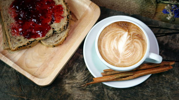 istock Leaf of Latte art and cappuccino coffee with cinnamon 692422342