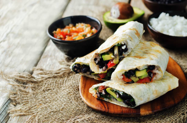 istock Rice black bean avocado tomato burritos 692423132