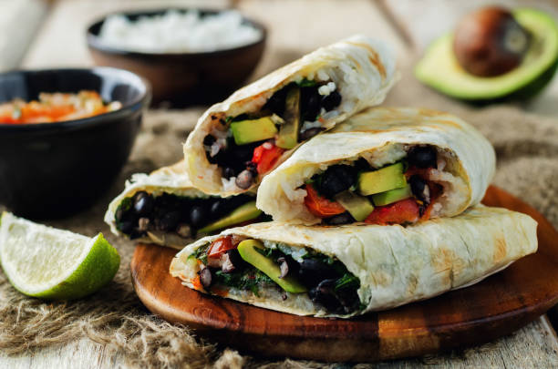 istock Rice black bean avocado tomato burritos 692423134