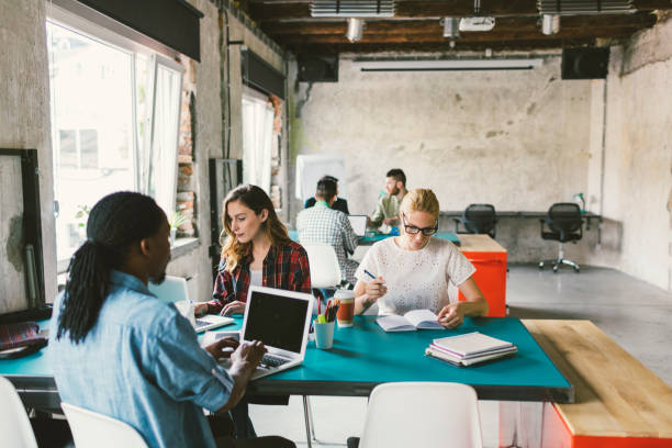 istock Coworkers in an open space office 692423586