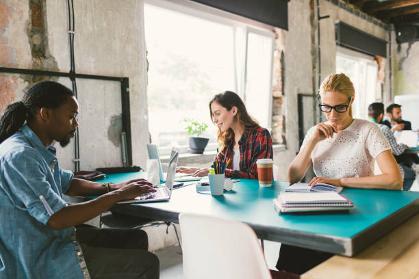 istock Coworkers in an open space office 692423598