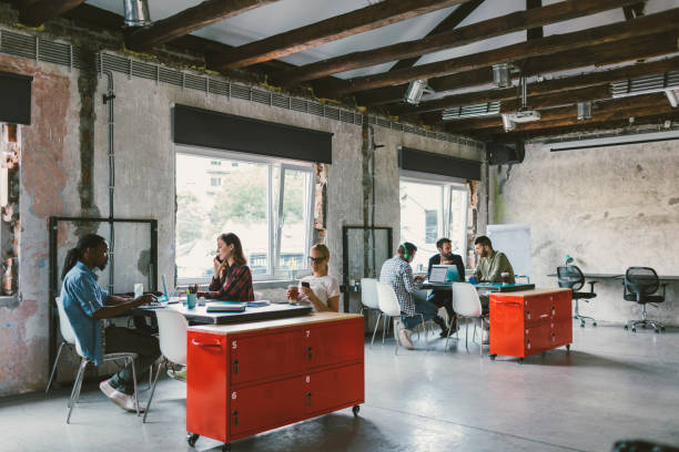 istock Coworkers in an open space office 692425828