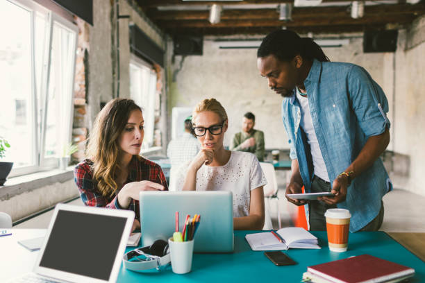 istock Coworkers in an open space office 692425988