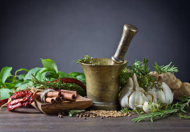 istock Different herbs and spices on a wooden table . 692437968