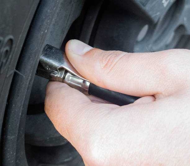 istock The man pumps up a tire. 692438296