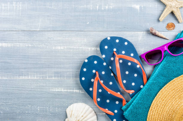 istock Beach accessories on a blue wooden background 692438490