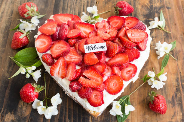 istock Welcome Card with Strawberries Cheesecake Heart Shaped 692438680