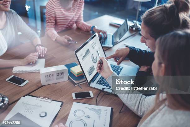 Young Business People Working Together In The Office Stock Photo - Download Image Now