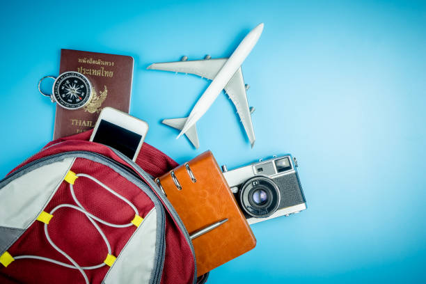istock Backpacker travel equipment on blue copy space 692442296