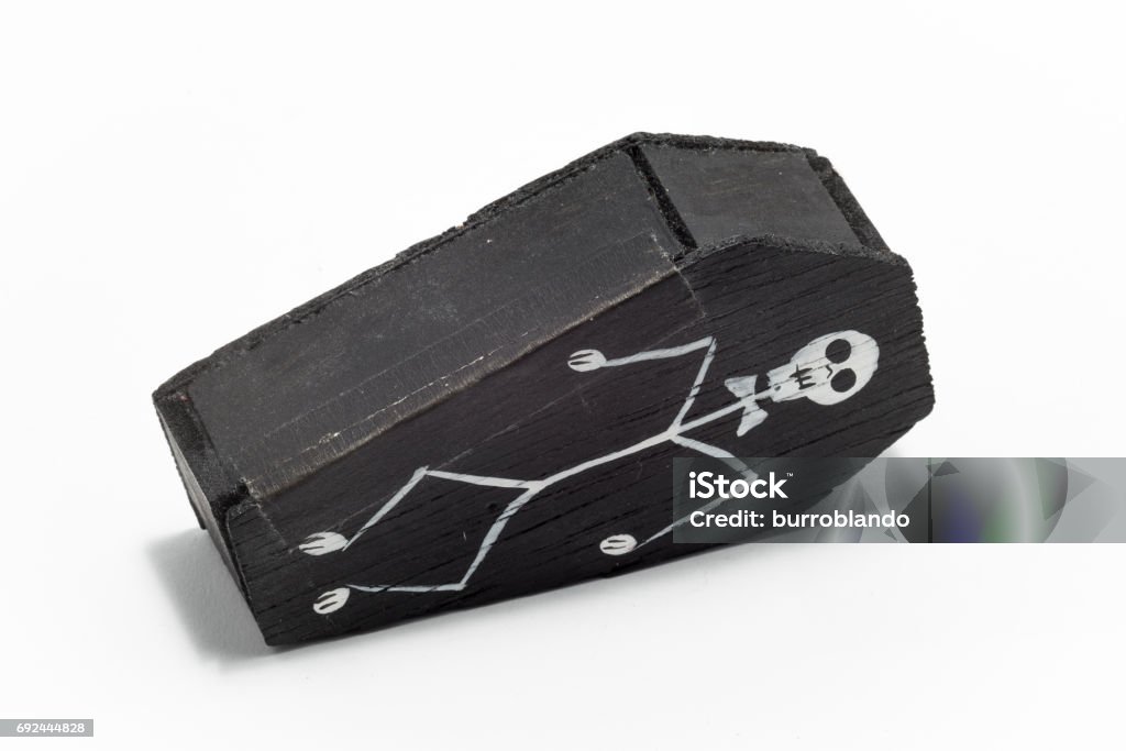 La Catrina in a small black wooden coffin with a skeleton on the front A mexican gift item celebrating the day of the dead that you might find in a tourist market or gift shop Coffin Stock Photo
