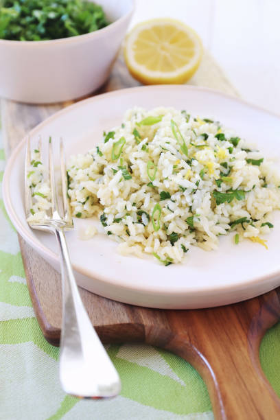 istock Spicy rice with green herbs and lemon 692444872
