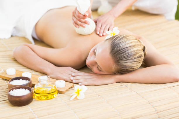 istock Attractive woman getting massage on her back 692448388