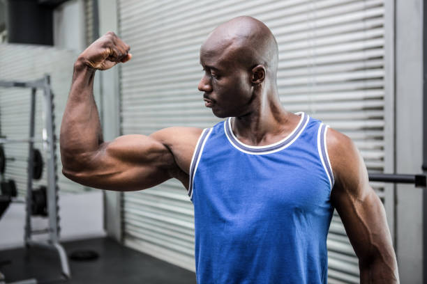 istock Young Bodybuilder in shirt looking at the camera 692449288