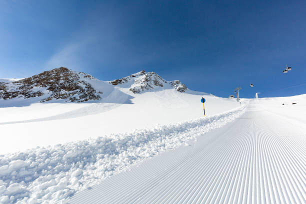 istock Newly groomed ski slope on a sunny day 692452908