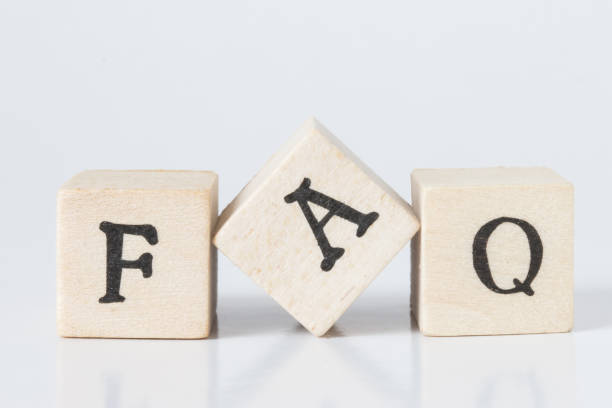 istock wooden cube written as FAQ,faq word made with building blocks,frequently asked question. 692455848