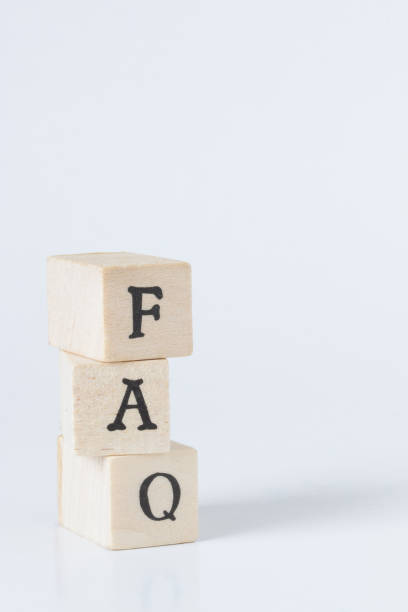 istock wooden cube written as FAQ,faq word made with building blocks,frequently asked question. 692455942