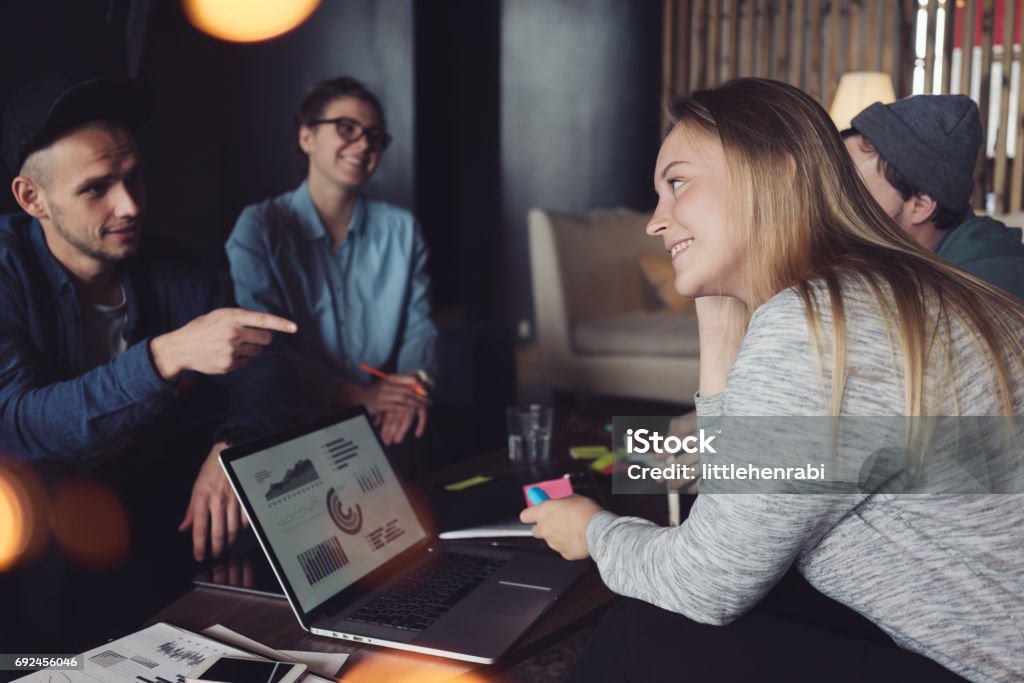 Group of people have meeting in coworking Group of young business people have meeting in office. New plan discussing. Four persons. Intentional lens flares Finance Stock Photo