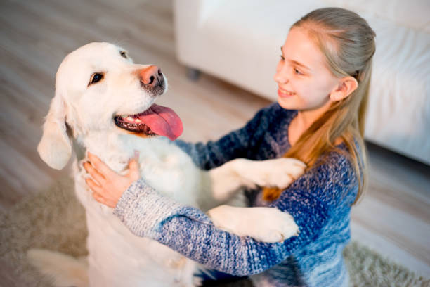 istock Girl with her dog 692458992