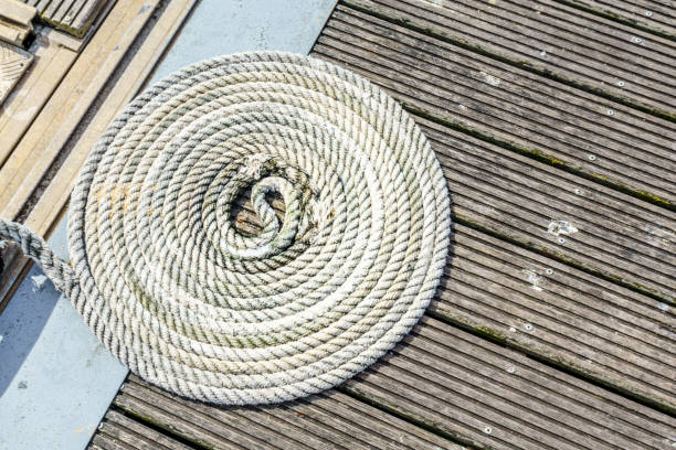 istock Coiled rope on harbour wooden floor 692459208