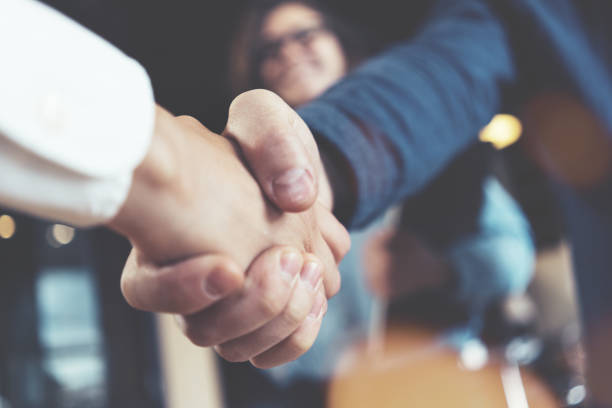 Business people shaking hands stock photo