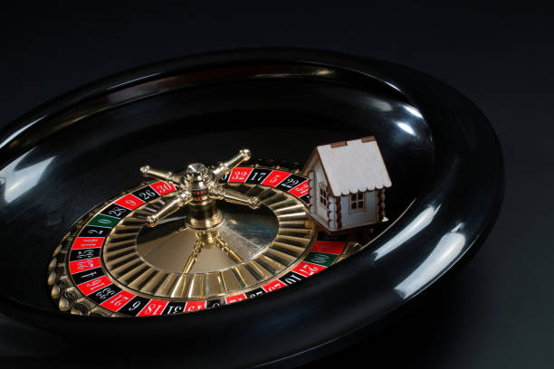 Portrait of a happy woman playing roulette at the casino and looking at the camera smiling - lifestyle concepts