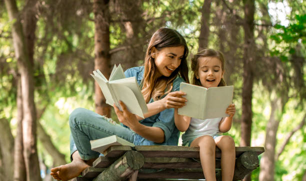 istock Mom and daughter read the book 692465260