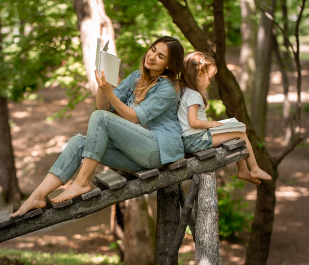 istock Mom and daughter read the book 692465280