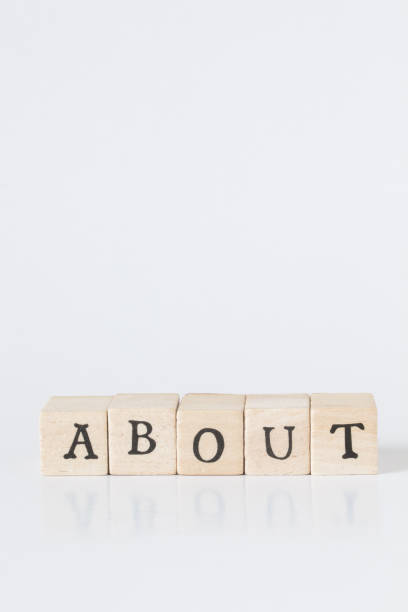 istock wooden cube written as ABOUT,word made with building blocks. 692466130