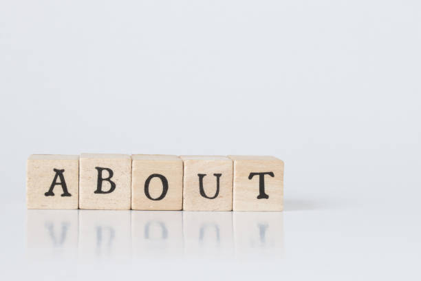 istock wooden cube written as ABOUT,word made with building blocks. 692466194