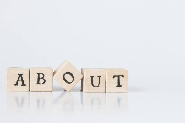 istock wooden cube written as ABOUT,word made with building blocks. 692466214