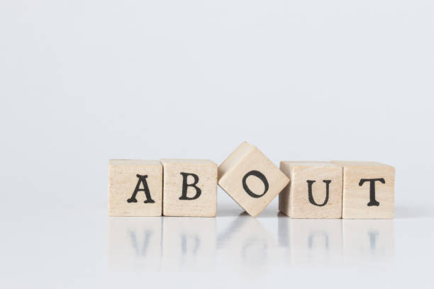 istock wooden cube written as ABOUT,word made with building blocks. 692466218