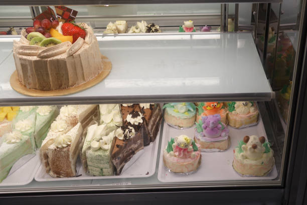 istock pieces of cake - bakery shopping window 692468628