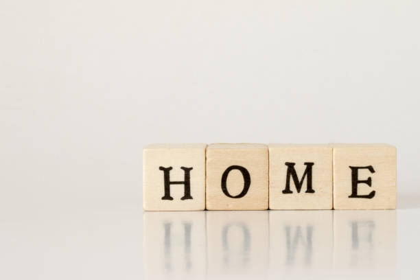 istock wooden cube written as HOME,word made with building blocks 692472984