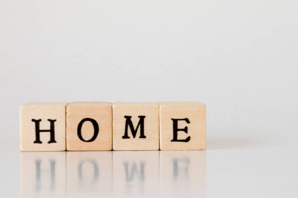 istock wooden cube written as HOME,word made with building blocks 692472986