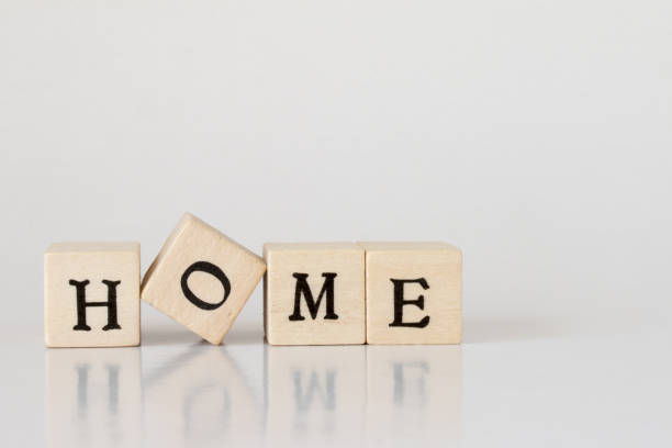 istock wooden cube written as HOME,word made with building blocks 692473074