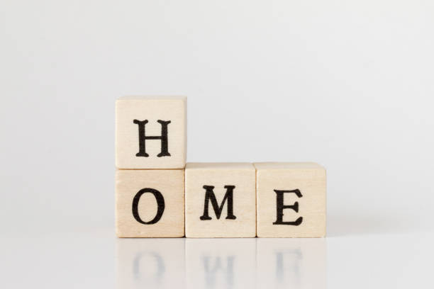 istock wooden cube written as HOME,word made with building blocks 692475390