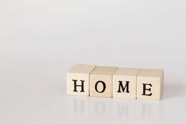 istock wooden cube written as HOME,word made with building blocks 692475432