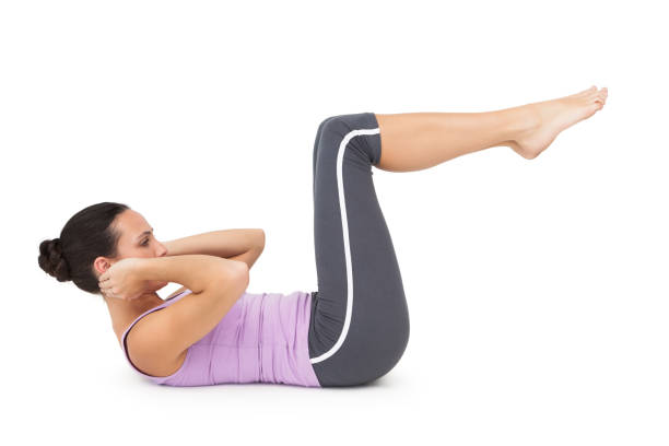 istock Side view of a fit young woman doing crunches 692475566