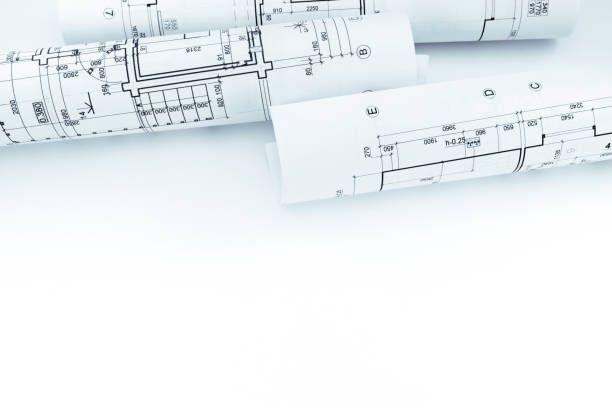 istock rolls of paper with graphical plans and architectural projects on white 692475666