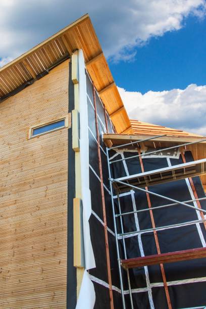istock Polystyrene insulation of wood buildings. Eco-friendly building insulation. 692479108